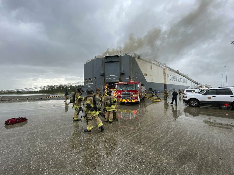 Firefighters respond to a fire aboard a ship Thursday in Jacksonville, Fla. An explosion occurred while crews were fighting the blaze.
(AP/The Jacksonville Fire and Rescue Department)