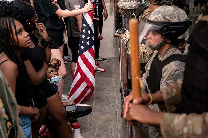 Protesters face off with National Guard troops near the White House on Wednesday. Career diplomats say privately that the violence seen in protests over George Floyd’s death undercut their criticism of foreign autocrats and calls for freedom and civil liberties in other countries.
(The New York Times/Erin Schaff)
