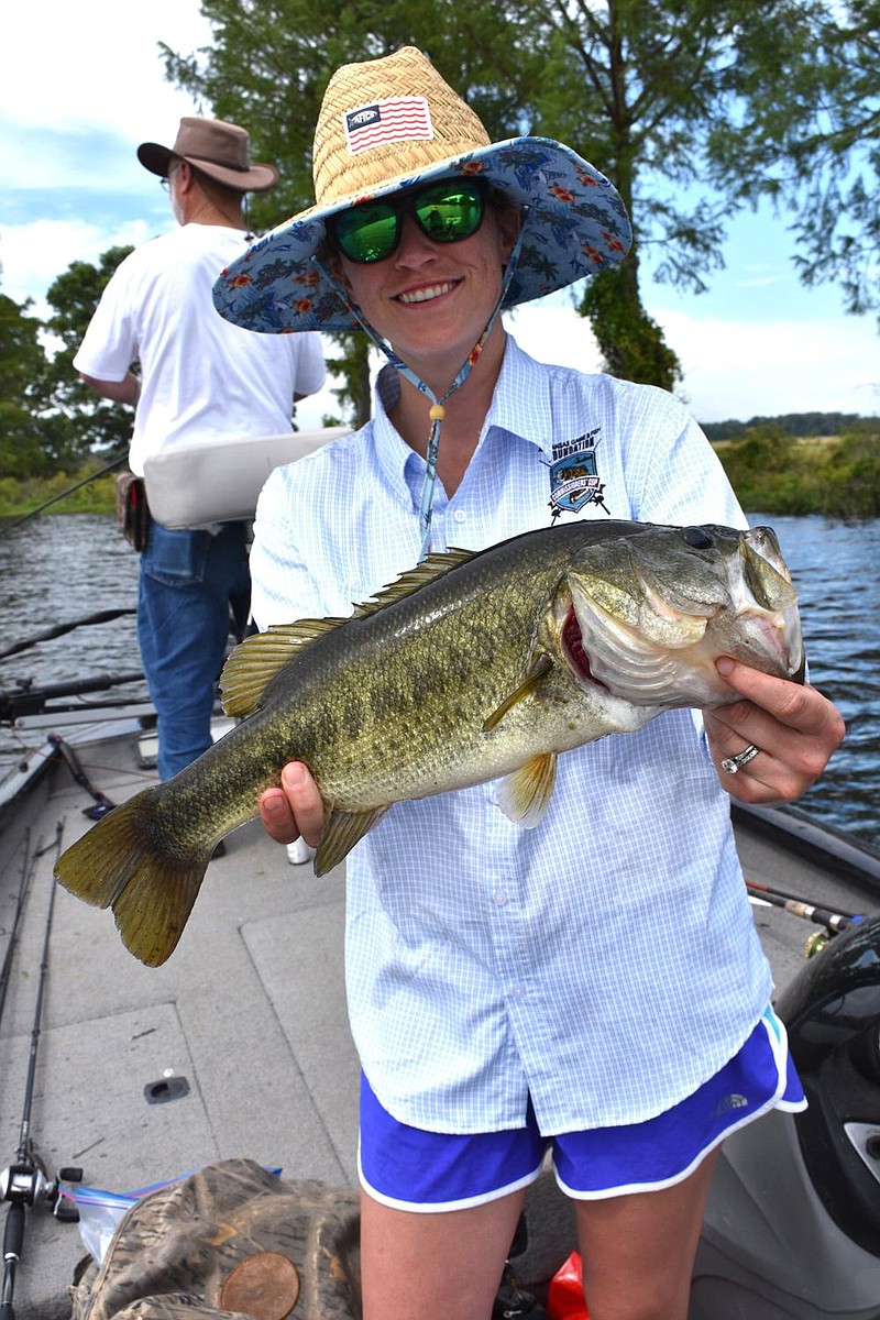After switching from a worm to a Whopper Plop- per, Anne Marie Doramus of Little Rock caught the biggest bass of the day Thursday in south- east Arkansas. 
(Arkansas Democrat-Gazette/Bryan Hendricks) 