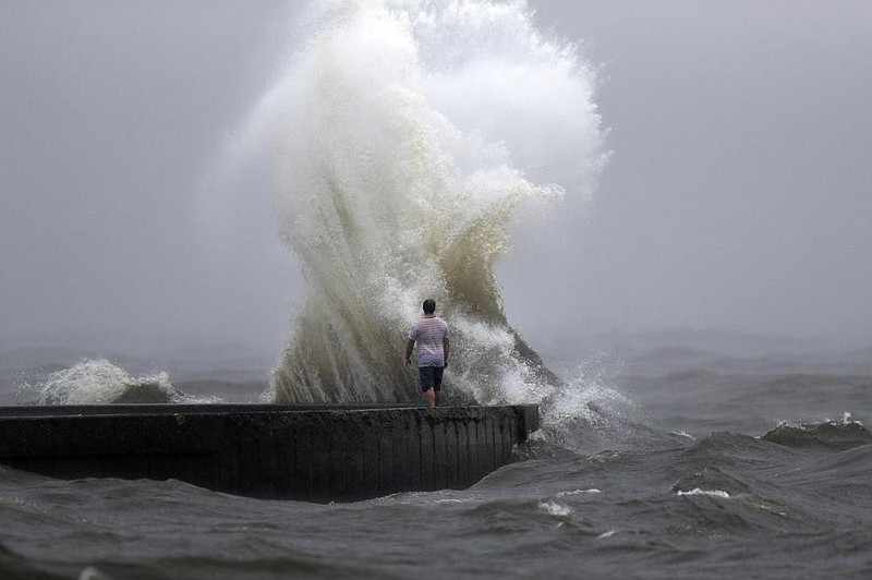 A wave crashes on a jetty Sunday at Lake Pontchartrain in New Orleans as Tropical Storm Cristobal approaches the coast. (AP/Gerald Herbert) 
