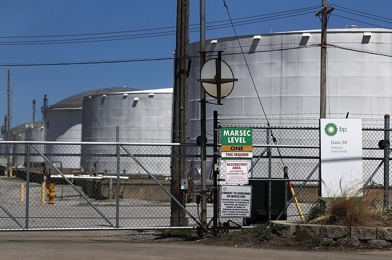 Petroleum storage tanks at the BP Indiana Tank Field in Whiting, Ind., are shown in April. BP chief ex- ecutive Bernard Looney has pledged to reduce the company’s capital expenditures by 25% this year. (AP/Charles Rex Arbogast) 
