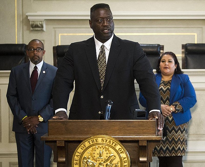 Fred Weatherspoon, deputy director of the Arkansas Law Enforcement Training Academy, takes Tuesday questions after Gov. Asa Hutchinson announced the establishment of a task force to study law enforcement methods. Pine Bluff Mayor Shirley Washington is part of the task force.
(Arkansas Democrat-Gazette/Stephen Swofford)