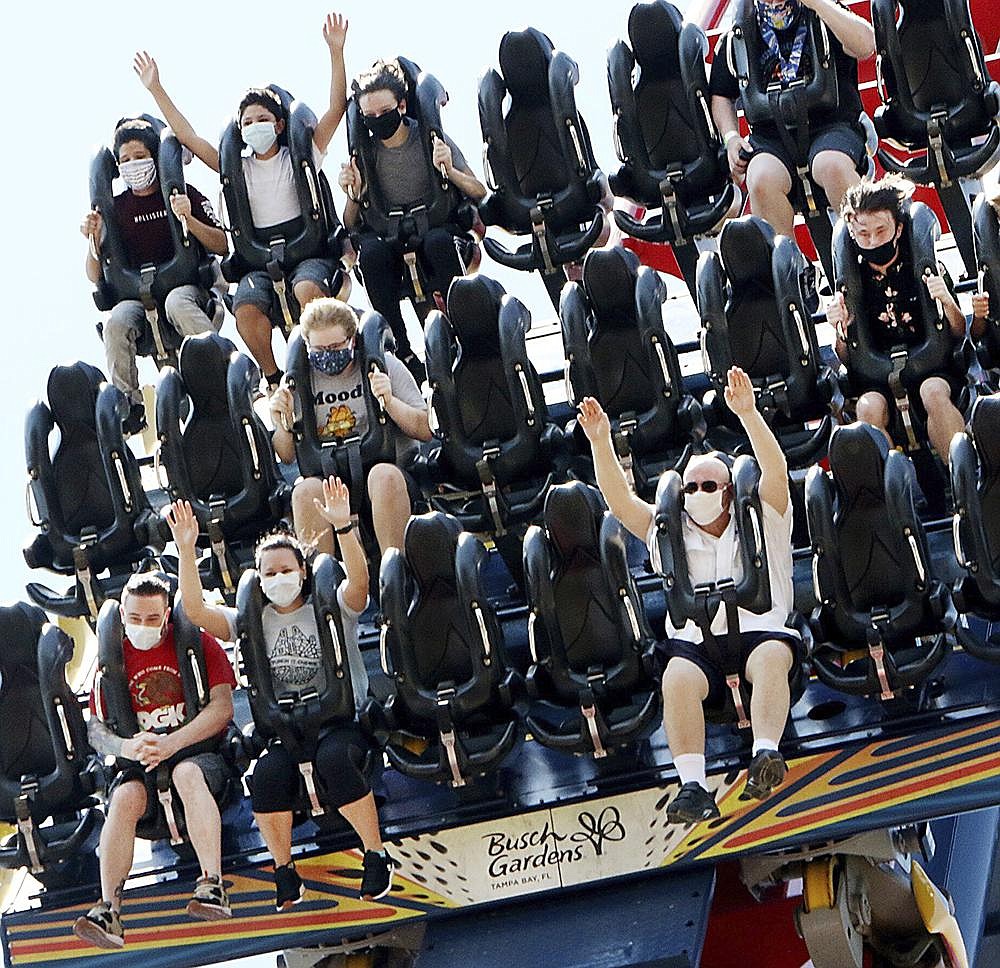 Patrons of Busch Gardens in Tampa Bay, Fla., enjoy the 200-foot dive on the SheiKra roller coaster Thursday. More photos at arkansasonline.com/612florida/.
(AP/Tampa Bay Times/Douglas R. Clifford)