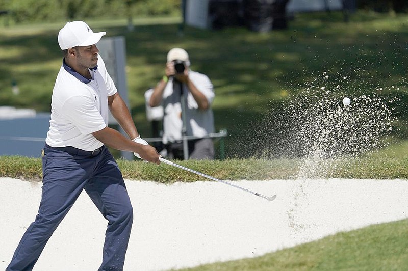 Harold Varner III hits out of the sand at the eighth green during the second round of the Charles Schwab Challenge on Friday at the Colonial Country Club in Fort Worth. Varner’s 4-under 66 gave him a one-shot lead.
(AP/David J. Phillip)