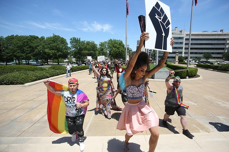 Drag queens and kings lead a Black Lives Matter protest up the steps of the state Capitol in Little Rock on Sunday. More photos at arkansasonline.com/615protest/. (Arkansas Democrat-Gazette/Thomas Metthe) 
