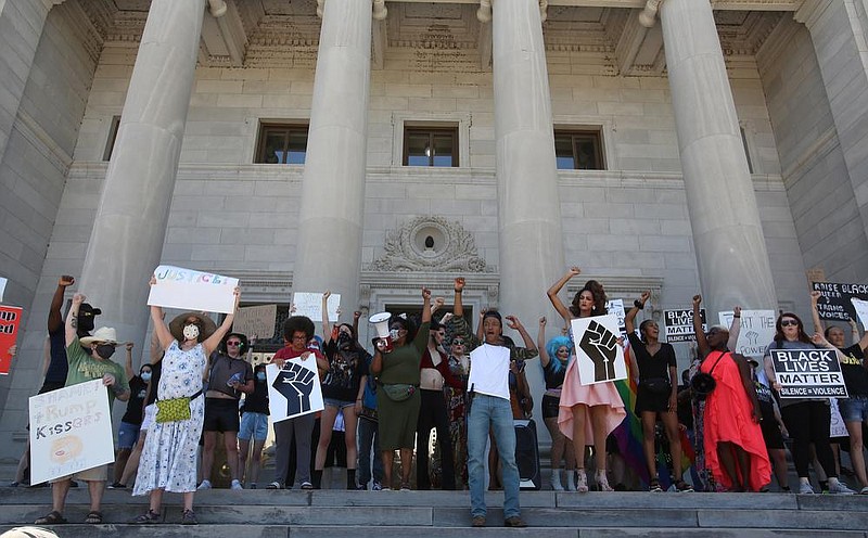 Protesters yell chants from the top of the steps of the state Capitol in Little Rock during a peaceful protest on Sunday, June 14, 2020. 
(Arkansas Democrat-Gazette/Thomas Metthe)