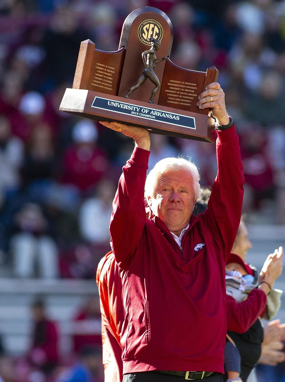 Arkansas Women's Track and Field coach Lance Harter holds up championship trophy at Donald W. Reynolds Stadium, Fayetteville, on Saturday, November 2, 2019. (Special to NWA Democrat Gazette David Beach) 