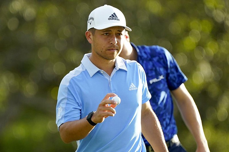 Xander Schauffele acknowledges the gallery on the 18th green during first round of the Tournament of Champions golf event, Thursday, Jan. 2, 2020, at Kapalua Plantation Course in Kapalua, Hawaii. (AP Photo/Matt York)