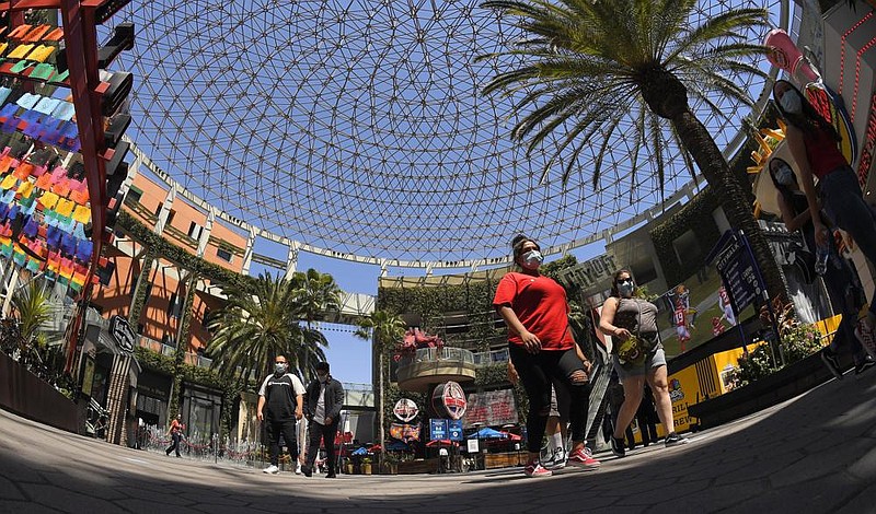 People walk through Universal CityWalk near Universal City, Calif., last week. (AP/Mark J. Terrill) 