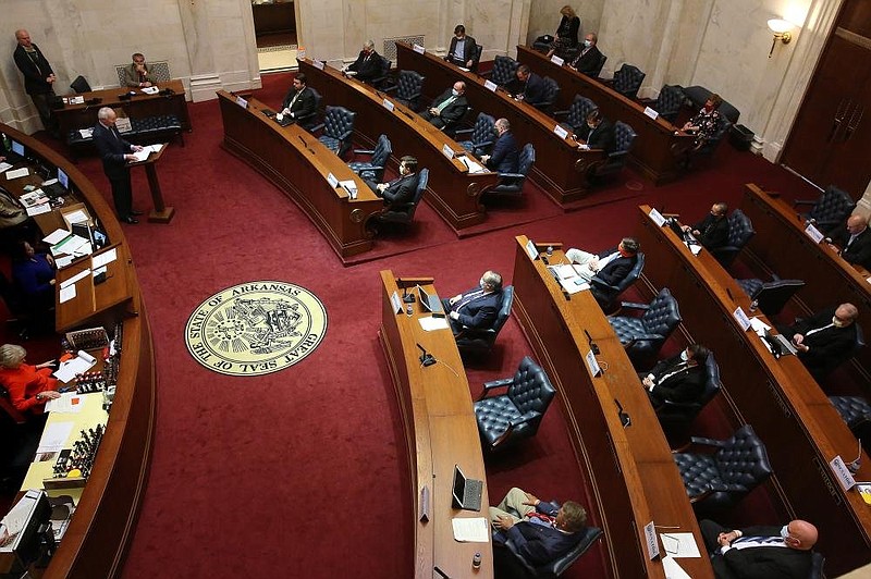 FILE: Gov. Asa Hutchinson gives the State of the State address on Wednesday, April 8, 2020, in the senate chamber of the state Capitol in Little Rock. 
