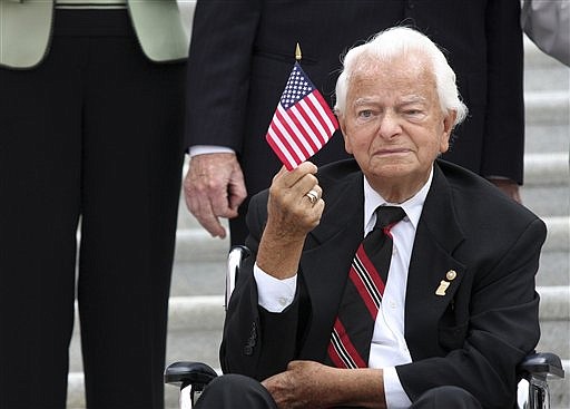Sen. Robert Byrd, D-W.Va., waves a flag during a ceremony on Capitol Hill in Washington on Sept. 11, 2008, in remembrance of the Sept. 11, 2001, terrorist attacks.