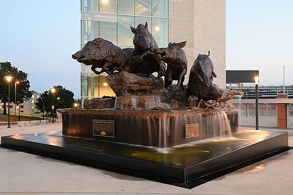 The Wild Band of Razorbacks sculpture stands Wednesday, June 3, 2020, outside Donald W. Reynolds Razorback Stadium in Fayetteville.