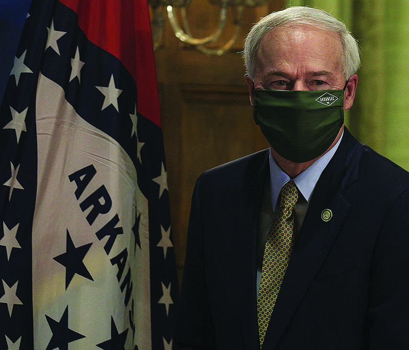 FILE — Gov. Asa Hutchinson arrives the state Capitol in Little Rock for his daily coronavirus briefing in this June 17, 2020 file photo. See more photos at arkansasonline.com/618governor/. 