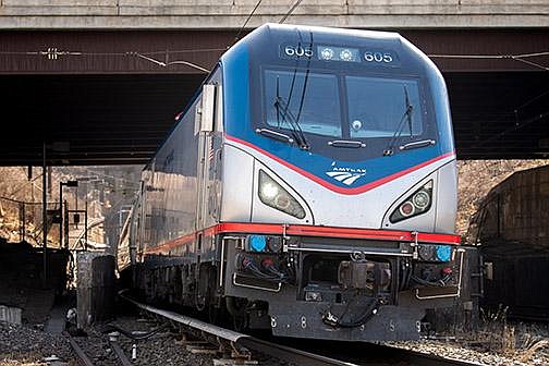 An Amtrak train exits the North River Tunnel in North Bergen, N.J., in 2019. Daily Amtrak service is set to end at hundreds of stations outside the Northeast region.
(Bloomberg News)