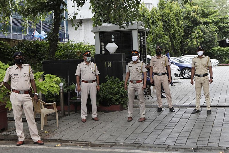 Indian police officers on Wednesday guard the Chinese Consulate in Mumbai, anticipating protests after Monday’s deadly clash in the Himalayas. More photos at arkansasonline.com/618army/.
(AP/Rajanish Kakade)