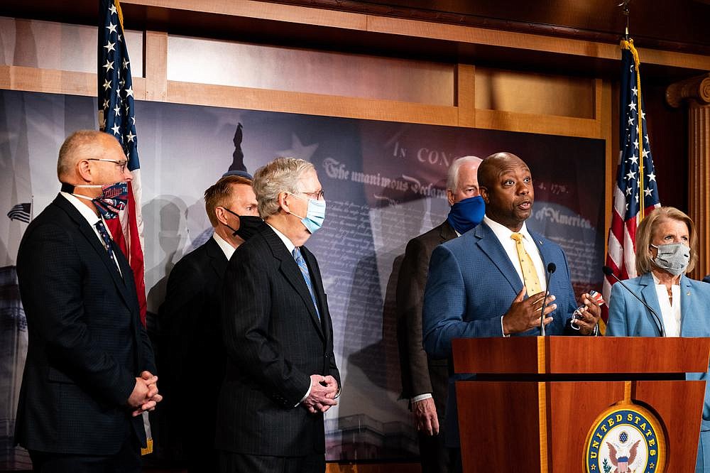 Sen. Tim Scott, with Senate Majority Leader Mitch McConnell and other GOP senators around him, said at a news conference Wednesday that there is a lot of overlap in House and GOP approaches to police overhauls, adding that “most of us want about 70% of the same change.”
(The New York Times/Anna Moneymaker)