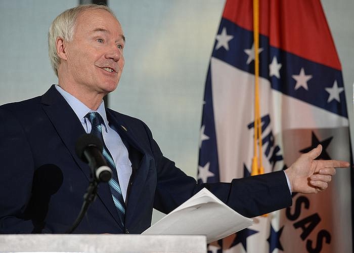 Gov. Asa Hutchinson, holding his coronavirus briefing Thursday at the U.S. Marshals Museum in Fort Smith, said an executive order gives him and Health Department Secretary Nate Smith “sole authority over all instances of quarantine, isolation, and restrictions on commerce and travel.”
(NWA Democrat-Gazette/Andy Shupe)