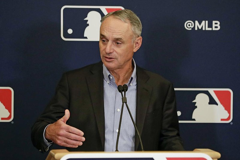 In this Feb. 6, 2020, file photo, Major League Baseball Commissioner Rob Manfred answers questions at a news conference during MLB baseball owners meetings in Orlando, Fla. 
(AP Photo/John Raoux, File)