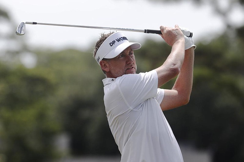 Ian Poulter watches his shot from the 17th tee during the first round of the RBC Heritage on Thursday in Hilton Head Island, S.C. Poulter finished with a 7-under 64, giving him a share of the lead with Mark Hubbard.
(AP/Gerry Broome)