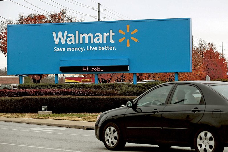 In this file photo a vehicle passes by the Walmart Home Office in Bentonville.
(NWA Media/JASON IVESTER)