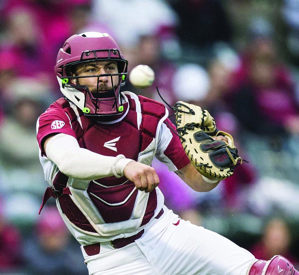 Teammates of Arkansas catcher Casey Opitz are excited to have him coming back to the team after he wasn’t selected in the MLB Draft. Opitz has started 64 of 74 games the past two seasons. (NWA Democrat-Gazette/Ben Goff)