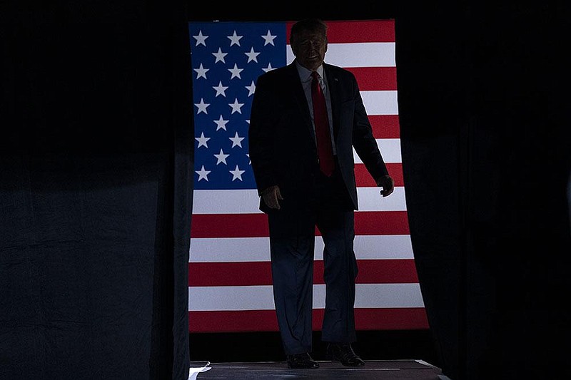 President Donald Trump takes the stage Saturday for his campaign rally at a partial- ly filled arena in Tulsa. More photos at arkansasonline. com/621tulsa/. 
(AP/Evan Vucci) 