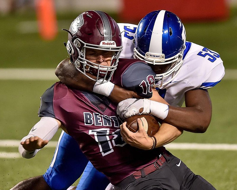 Bryant defensive tackle Rodricho Martin (53) tackles Benton quarterback Peyton Hudgins during last year’s Salt Bowl at War Memorial Stadium in Little Rock. Salt Bowl Committee spokesman Shane Broadway said the goal is to have this year’s game at War Memorial Stadium, with or without fans.
(Democrat-Gazette file photo) story.lead_photo.caption
