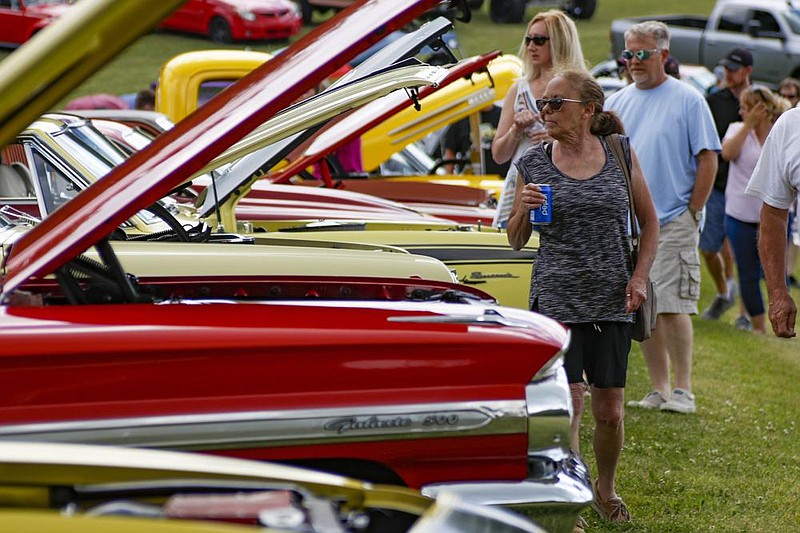 Visitors check out the classic vehicles Saturday at a car show in Portersville, Pa. (AP/Keith Srakocic) 
