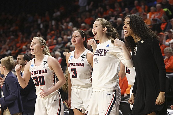 The Gonzaga bench, including, from left to right, Chandler Smith (30), Jenn Wirth (3), Gillian Barfield and Kylee Griffin, celebrate a call in their favor during the second half of a first-round game of the NCAA women's college basketball tournament against Little Rock in Corvallis, Ore., Saturday, March 23, 2019. (AP Photo/Amanda Loman)

