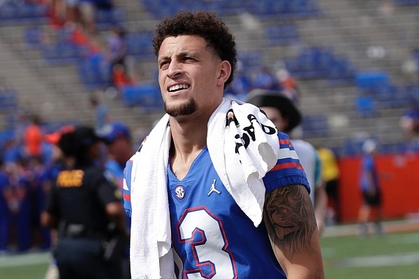 Injured Florida quarterback Feleipe Franks heads off the field after watching his teammates defeat Tennessee in an NCAA college football game, Saturday, Sept. 21, 2019, in Gainesville, Fla. Franks was injured the week before in a game against Kentucky. (AP Photo/John Raoux)