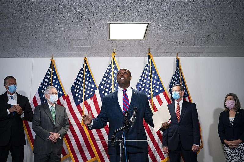 “This is not about them or us,” U.S. Sen. Tim Scott told reporters Tuesday in remarks on police overhaul legislation. It’s about young people and others, he said, “who are afraid to jog down the street or get in their car and drive.” (The New York Times/Al Drago) 