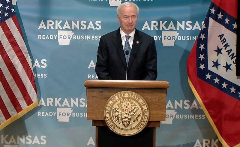Arkansas Gov. Asa Hutchinson speaks to reporters at the Capitol in Little Rock on Wednesday in this still of video provided by the governor's office. 