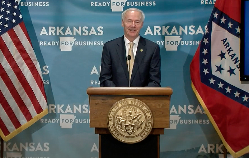 Arkansas Gov. Asa Hutchinson speaks to reporters at the state Capitol in Little Rock on Friday in this still of video provided by the governor's office. 