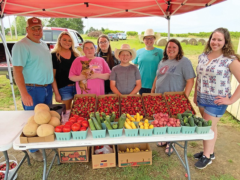 The Tom Henry family of Guy is the 2020 Faulkner County Farm Family of the Year. The family includes, front row, from left, Tom, Caroline, Gabe, Jamie and Morgan; and back row, Scout, Savannah and Katie Henry. Not shown is Alexis Henry, who lives in Kansas. The family raises a variety of fruits and vegetables, as well as cattle.
