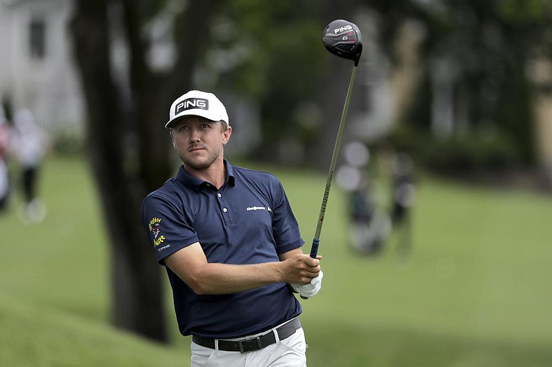 Mackenzie Hughes, of Canada, watches his tee shot from the third hole during the first round of the Travelers Championship golf tournament at TPC River Highlands, Thursday, June 25, 2020, in Cromwell, Conn. 
(AP Photo/Frank Franklin II)