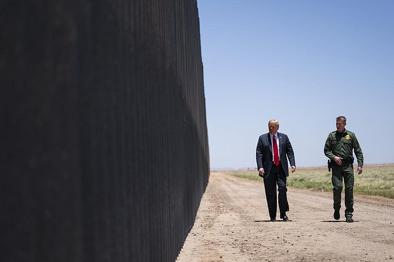 U.S. Border Patrol chief Rodney Scott gives President Donald Trump a tour of a section of the border wall Tuesday in San Luis, Ariz.
(AP/Evan Vucci) story.lead_photo.caption
