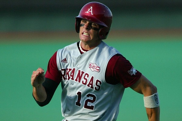 Arkansas' Craig Gentry runs toward home plate to score against the University of Texas Saturday night in the second round of the NCAA Baseball Austin Regional. Gentry was a four-sport standout at Fort Smith Christian from 2000 to 2002 and was a member of five state championship teams in three different sports in high school.