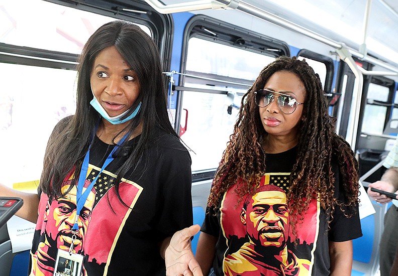 Angela Harrelson, left, of Minneapolis, Minn., and Paris Stevens, of Charlotte, N.C., talk with The Sentinel-Record prior to speaking at an Arkansas Martin Luther King, Jr. Commission Get Out to Vote event at the Hot Springs Farmers & Artisans Market Saturday. - Photo by Richard Rasmussen of The Sentinel-Record