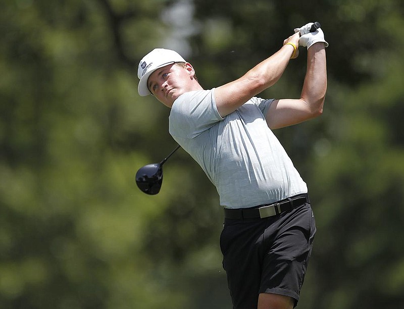 Matthew Cole tees off on the 12th hole during the final round of the Arkansas Amateur on Sunday at the Hot Springs Country Club. Cole won by six strokes and finished the event at 11 under. See more photos at www.arkansasonline.com/629asga/ (Arkansas Democrat-Gazette/Thomas Metthe) 