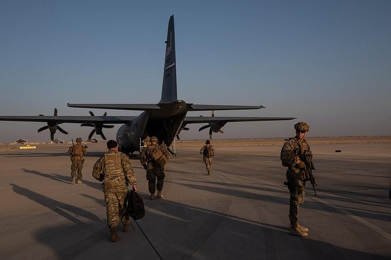 American troops work at Camp Shorabak in Helmand province, Afghanistan on Sept. 26. Intelligence officials say a Russian unit secretly offered bounties to Taliban-linked militants to kill coalition forces in Afghanistan.
(The New York Times/Jim Huylebroek)