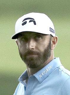 Dustin Johnson reacts after sinking his putt on the 15th green during the final round of the Travelers Championship golf tournament at TPC River Highlands, Sunday, June 28, 2020, in Cromwell, Conn. (AP Photo/Frank Franklin II)