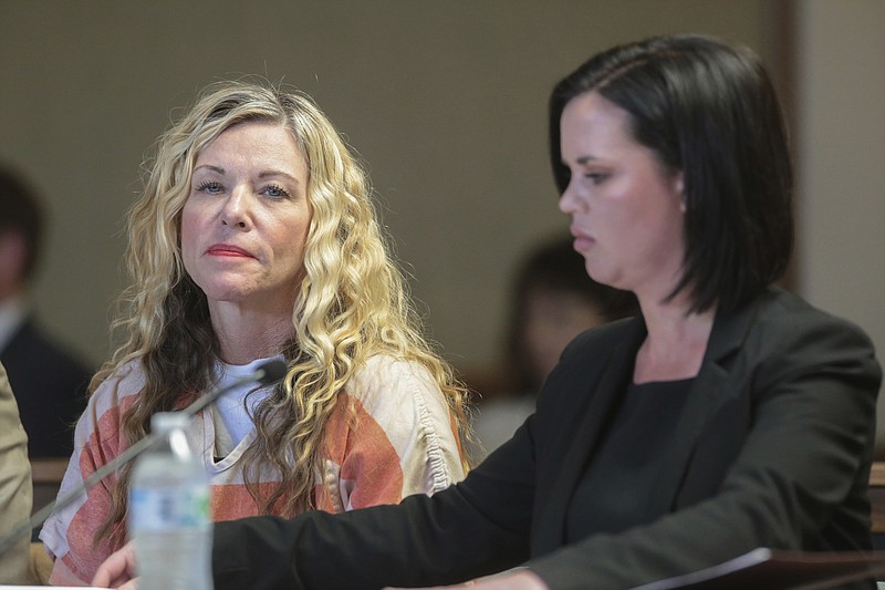 FILE - In this March 6, 2020, file photo, Lori Vallow Daybell glances at the camera during her hearing, with her defense attorney, Edwina Elcox, right, in Rexburg, Idaho. Prosecutors say the mother of two children who were found dead in rural Idaho months after they vanished in a bizarre case that captured worldwide attention had conspired with her new husband to hide or destroy the kids' bodies. The new felony charges against Lori Vallow Daybell came late Monday, June 29, 2020, the latest twist in a case tied to the mysterious deaths of both of the couple's former spouses and their beliefs about zombies and the apocalypse. story.lead_photo.caption