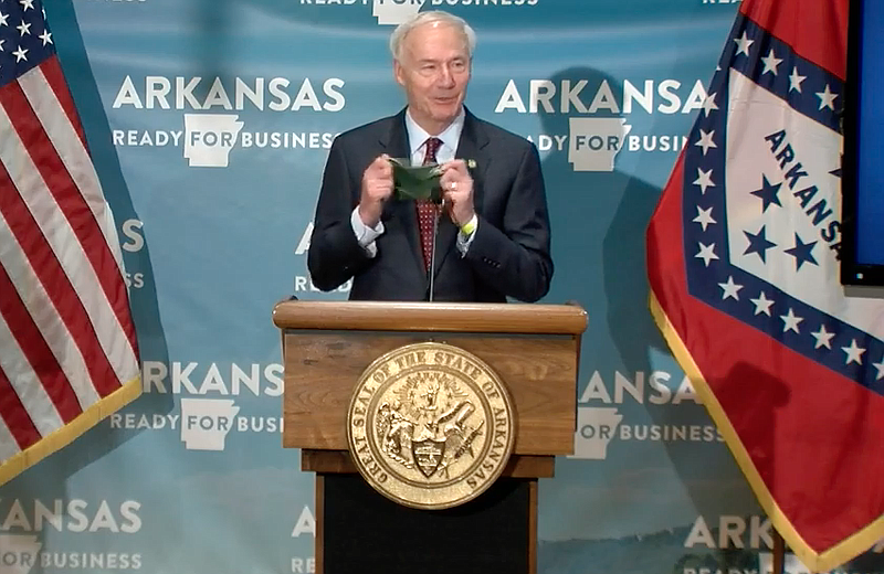 Arkansas Gov. Asa Hutchinson speaks to reporters at the state Capitol in Little Rock on Tuesday in this still of video provided by the governor's office. 