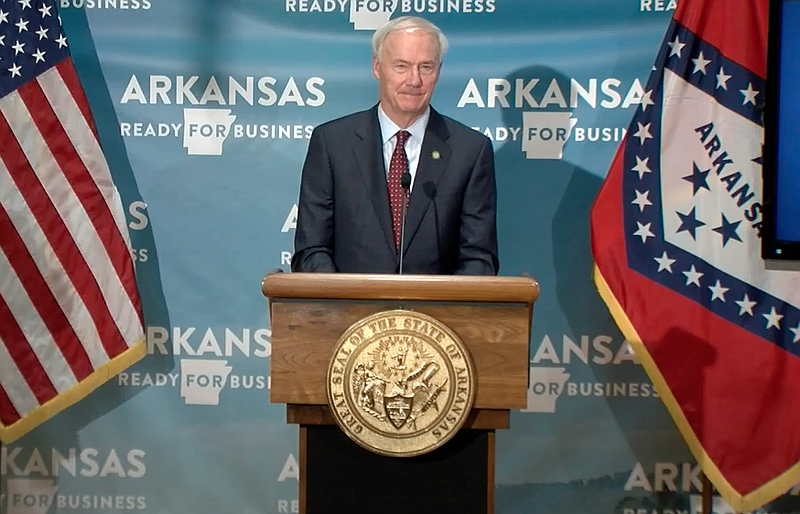 Arkansas Gov. Asa Hutchinson speaks to reporters at the state Capitol in Little Rock on Tuesday in this still of video provided by the governor's office. 