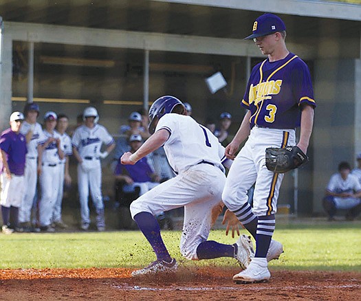 Siandhara Bonnet/News-Times El Dorado infielder Chase Webb scores as Junction City's Keelan Hodge covers the plate during their showdown earlier this season. Webb lost his junior and senior years with the Wildcats due to Tommy John surgery and the outbreak of the coronavirus pandemic, but has returned to the diamond this summer with the Arkansas Sticks.