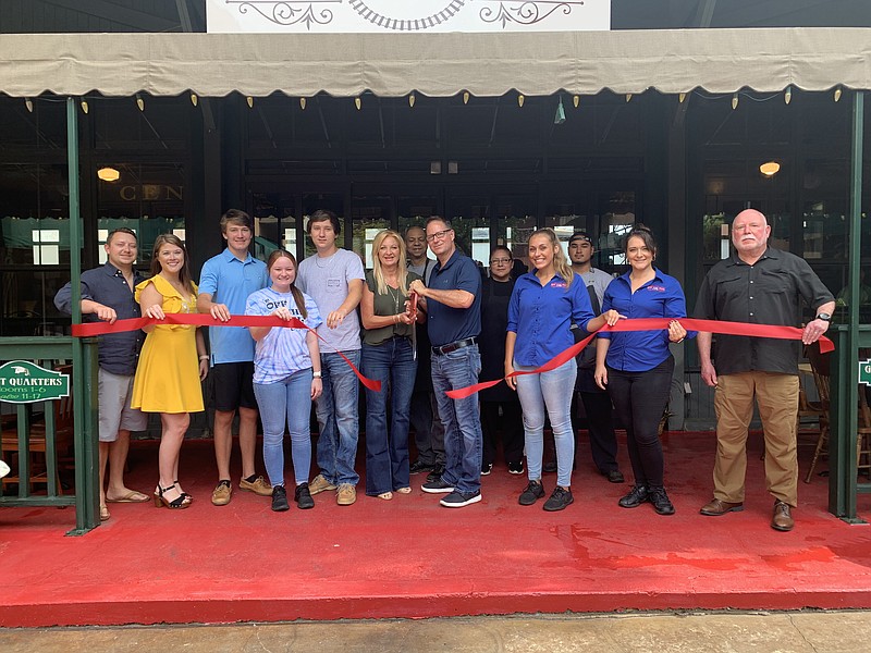 Ribbon Cutting: Off The Rail Café held a ribbon cutting Tuesday with the El Dorado-Union County Chamber of Commerce to celebrate the opening of the new restaurant. Off The Rail Café is located at 220 E. Main Street in downtown El Dorado. Above, from left, Jake Brumley, Teri Beth Brumley, Saxon Morgan, Nichole Davis, Sawyer Morgan, Angela Morrison (owner), Brandon Baker, Dean Morrison (owner), Irma Buelna, Jordan Vonneumann, Levi Espino, Yvette Swilley and Bill Luther. (Contributed)