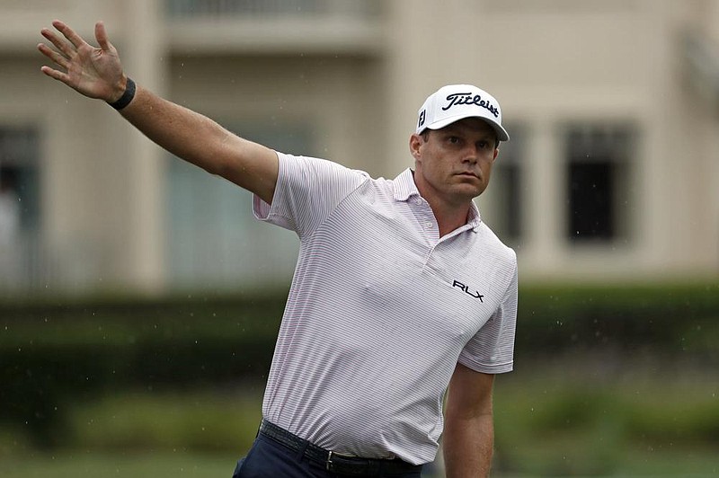 In this photo taken Thursday, June 18, 2020 Nick Watney signals after a tee shot during the first round of the RBC Heritage Golf tournament at Harbour Town Golf Links in Hilton Head, S.C. Watney has tested positive for coronavirus and did not play in Friday's round. (AP Photo/Gerry Broome) story.lead_photo.caption