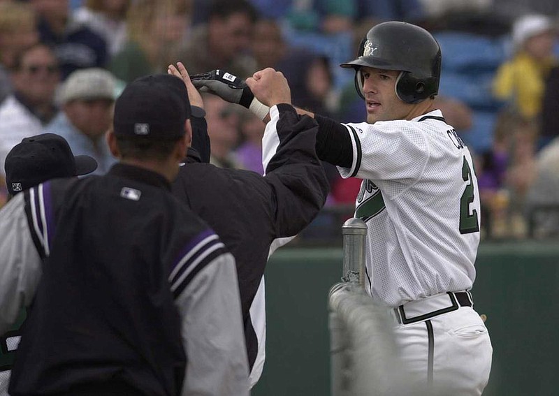 special to the Arkansas Democrat-Gazette/JAY JANNER/The Gazette

Sky Sox' Bubba Carpenter is congratulated by teammates after hitting a homerun in the second inning against Edmonton on 4/14/00.  Jay Janner/The Gazette