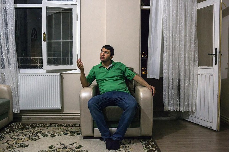 NASA scientist Serkan Golge sits in his apartment in Hatay, Turkey, in September. (The New York Times/Mauricio Lima) 