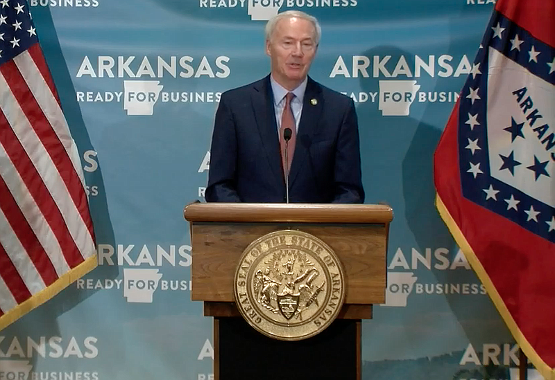 Arkansas Gov. Asa Hutchinson speaks to reporters at the state Capitol in Little Rock on Tuesday in this still of video provided by the governor's office.
